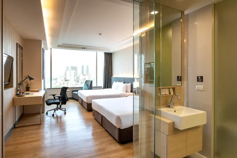 Room with two double beds.