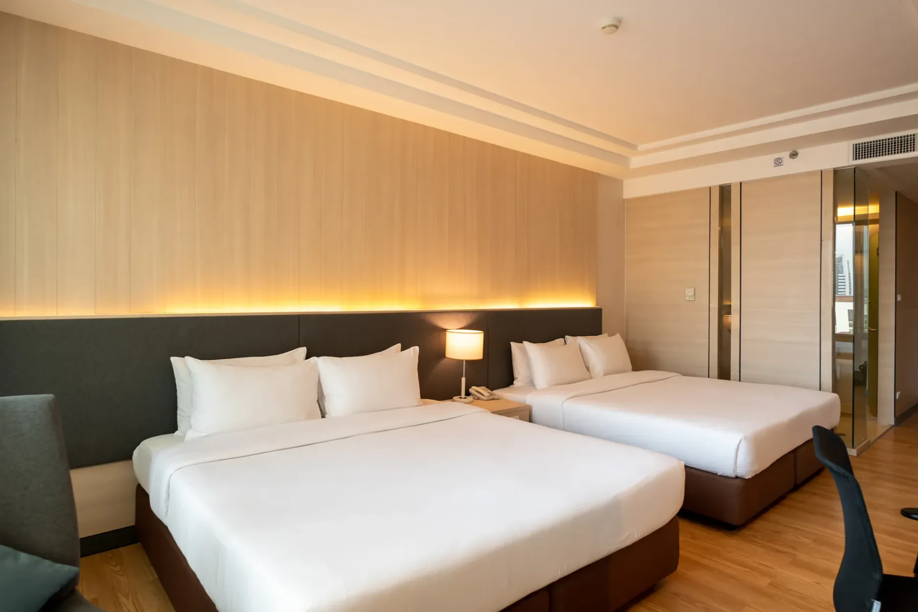Room with two double beds.