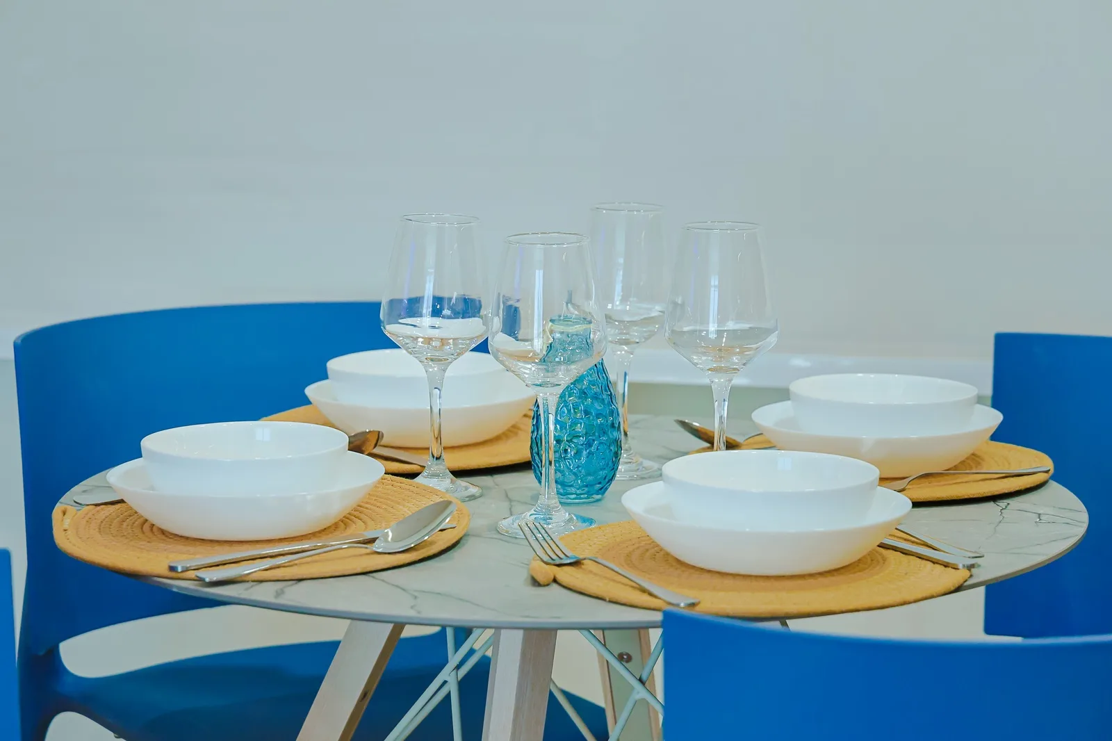 Gather around this beautifully set table where your memorable vacation meals await. Fresh linens, sparkling glassware, and charming coastal touches create the perfect setting for dining together.