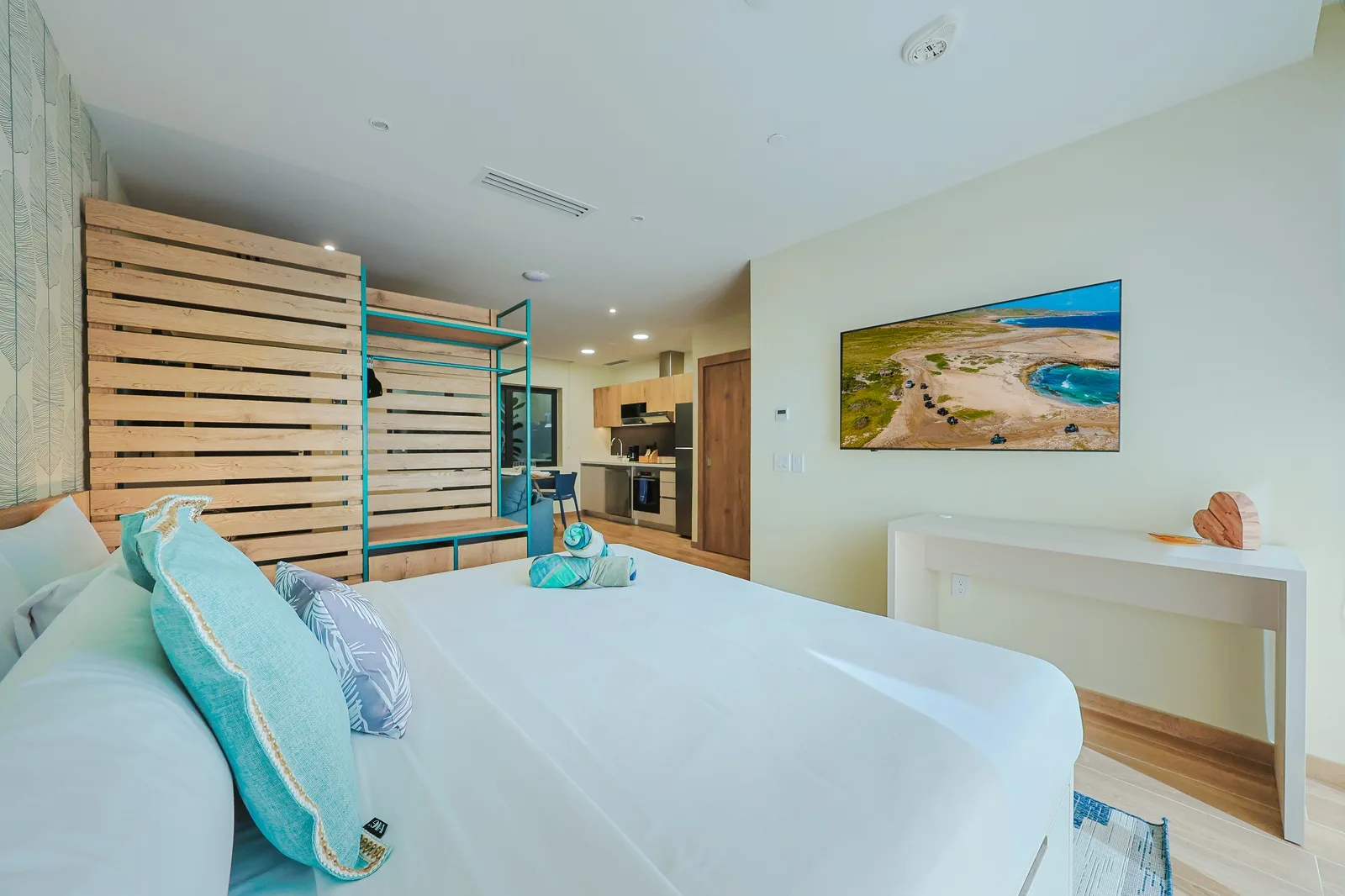 Sink into crisp linens and coastal vibes, where turquoise accents mirror beachside bliss. Your private retreat features a plush king-size bed and, a fully equipped kitchen for easy mornings.