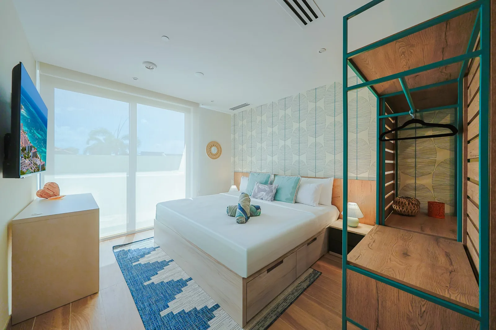 Your coastal retreat awaits with ocean-view windows, a plush bed with storage, and beachy accents that capture the relaxed vibe of your seaside escape.