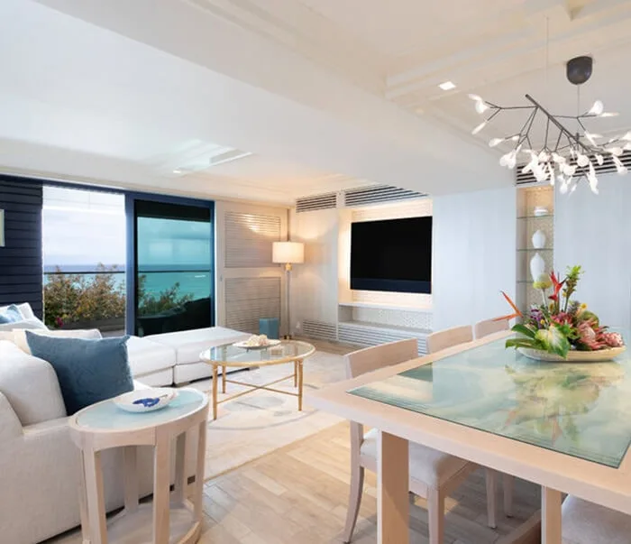Oceanfront Suite living room and balcony overlooking the ocean.