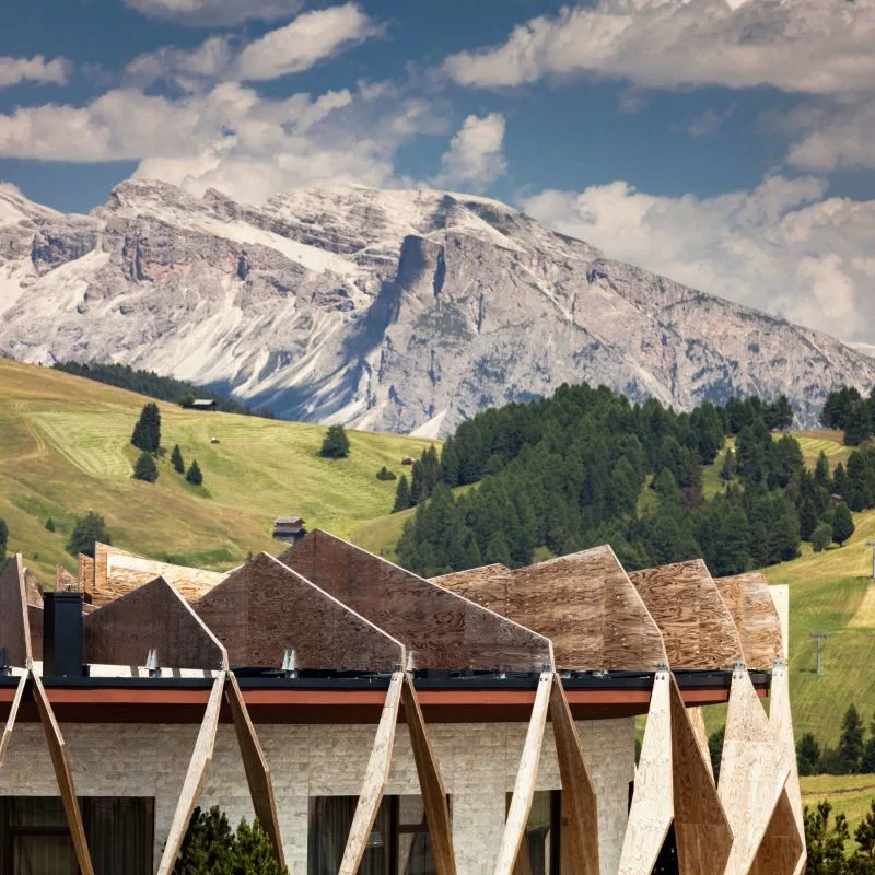 Hotel building with mountain backdrop