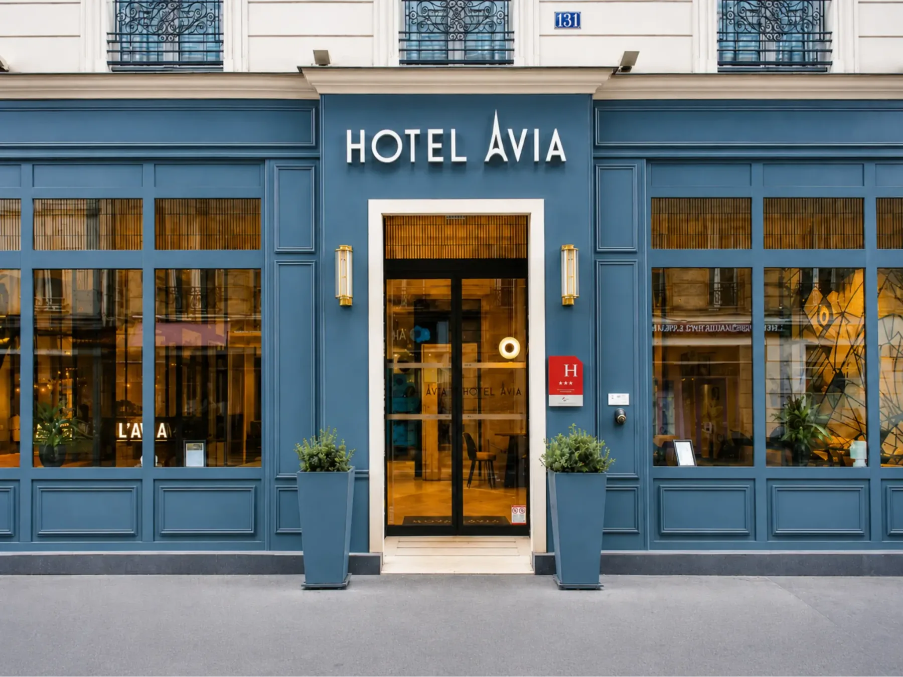 Hotel facade with entrance and sign