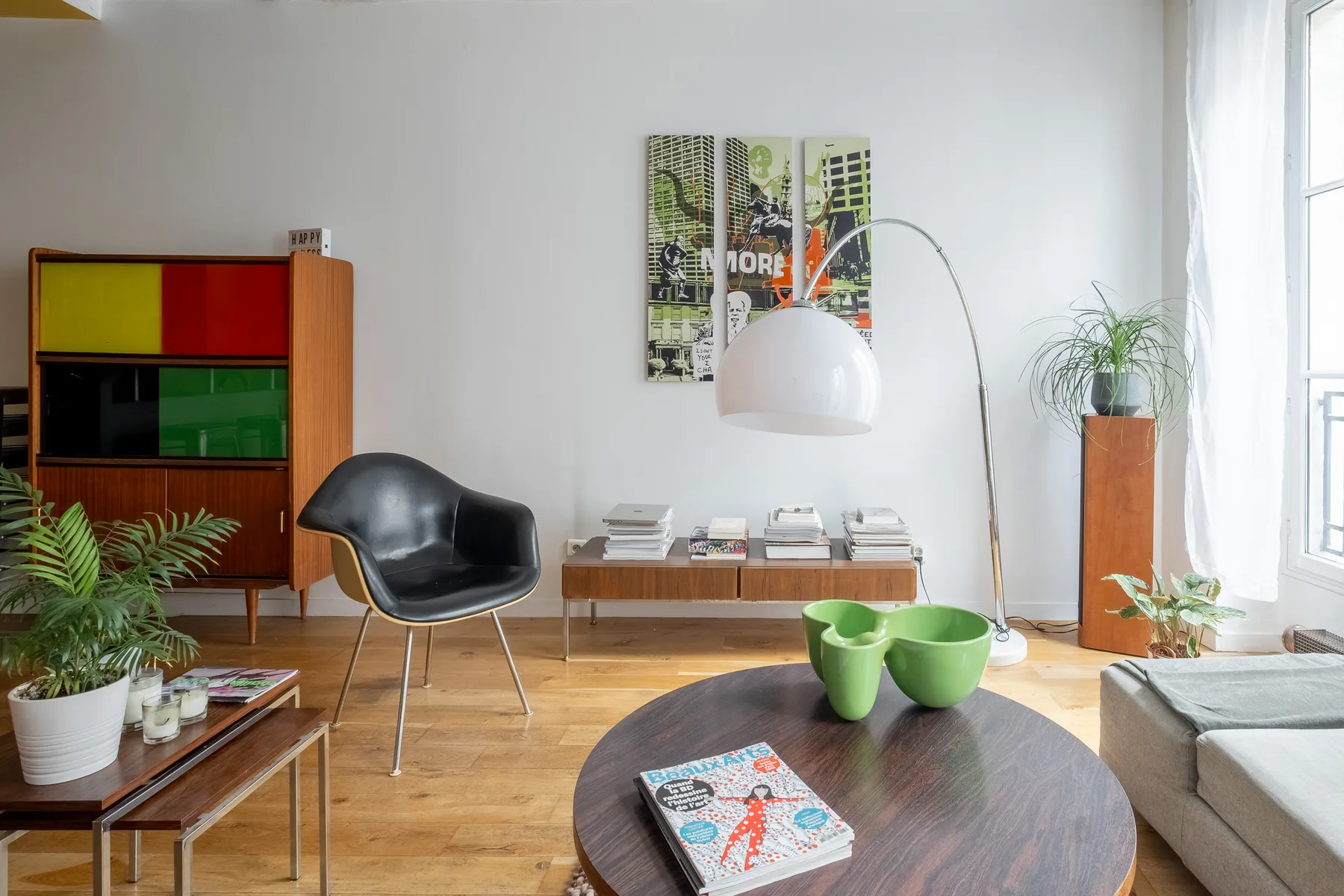 A living room with seating, a low table, and a floor lamp.