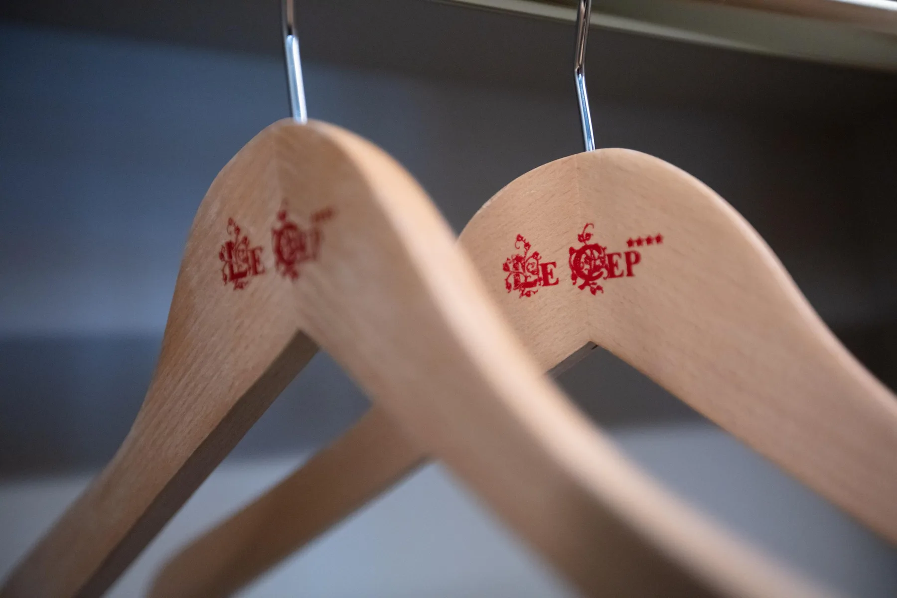 Two wooden clothes hangers