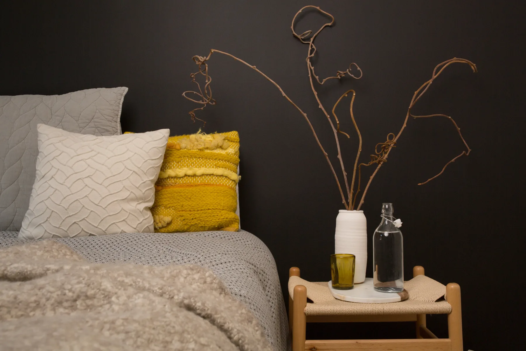 Guest room with a bed and bedside table