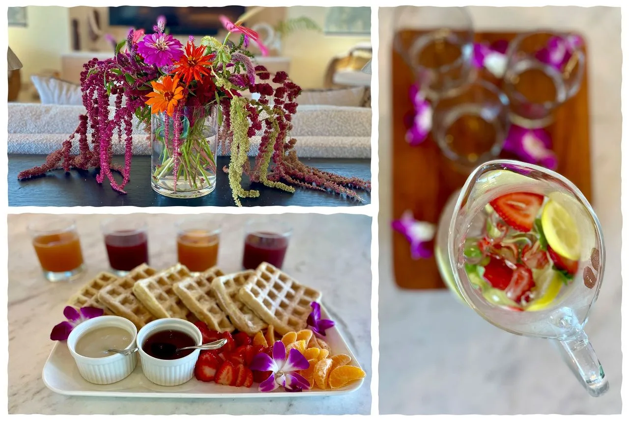 A floral centerpiece and a breakfast spread with waffles, fruit, and drinks.