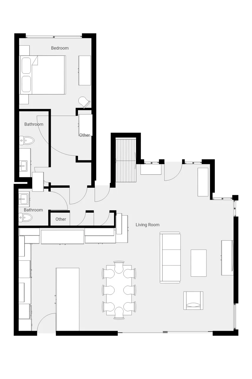 Un plano muestra un dormitorio, baños y una sala de estar con comedor.