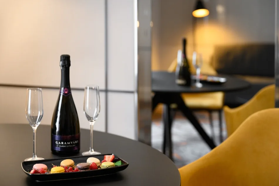 In-room sparkling wine and macarons.