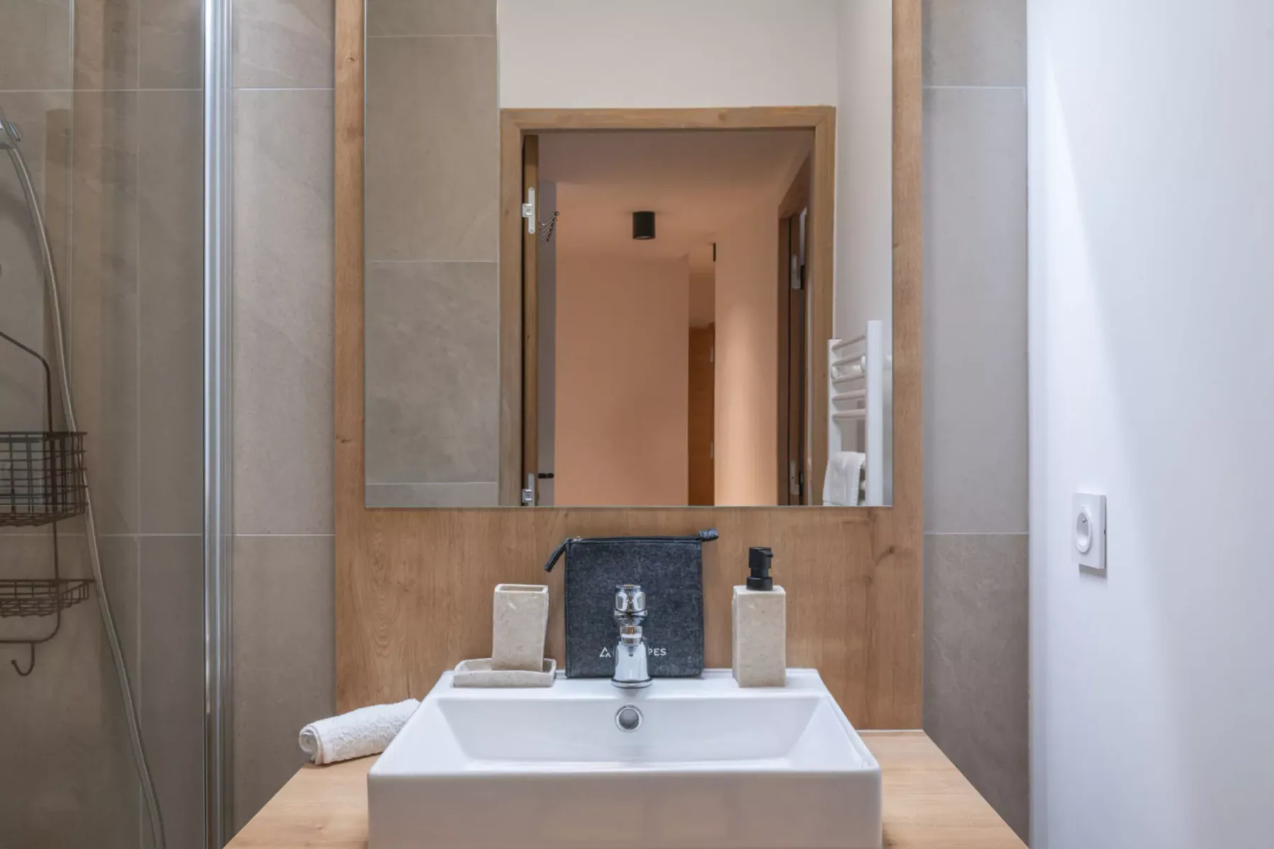A bathroom vanity with a sink and mirror above the counter.