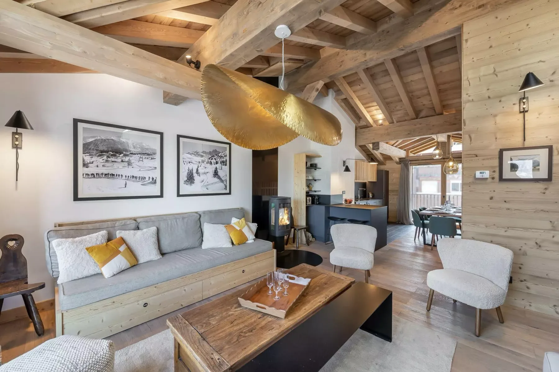 A timber-beamed living room features a sofa and a coffee table.