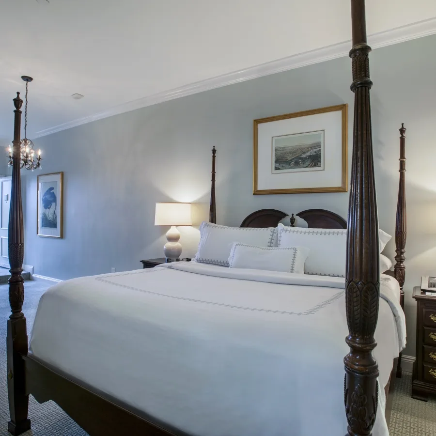 Sundeck King room with a four-poster bed and access to the sundeck.