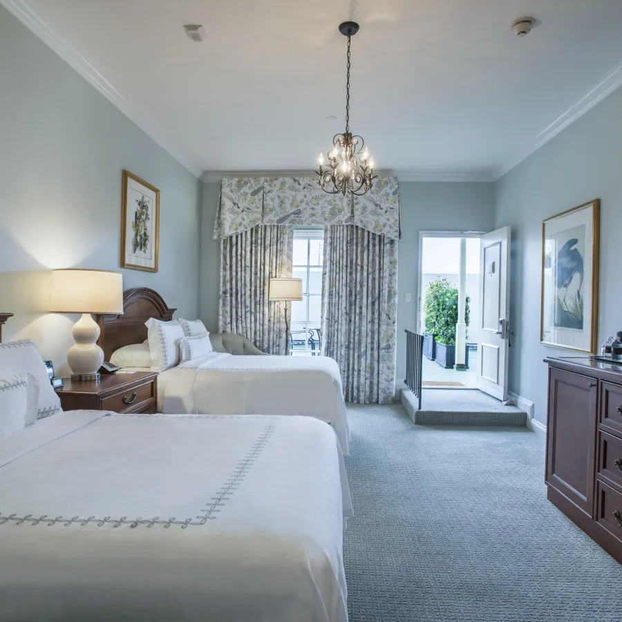 Sundeck Double/Double room with two double beds and access to an outdoor sundeck.