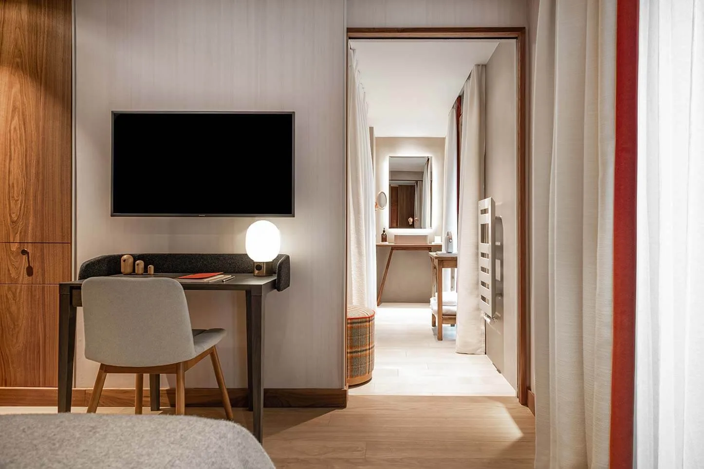 Guest room with desk and television