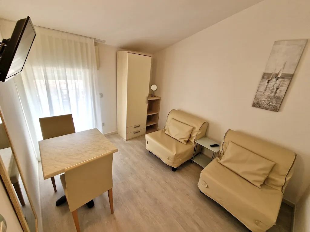 Sitting area with beige sofas and table