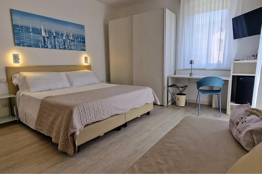 Large room with double bed and desk