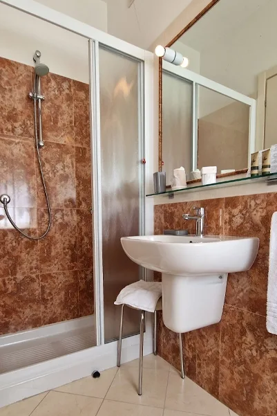 Bathroom with shower and sink