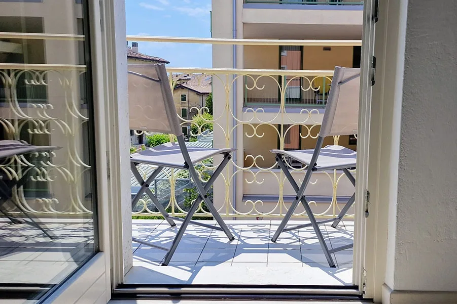 Sunny balcony with urban view