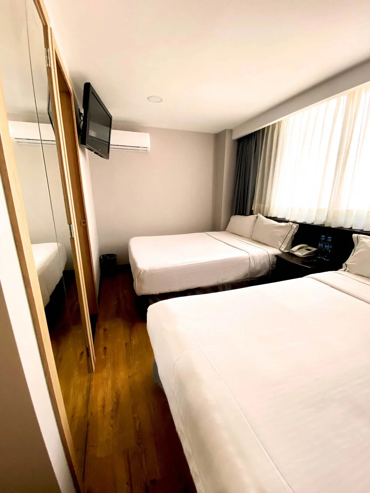 Deluxe room with two double beds and city view