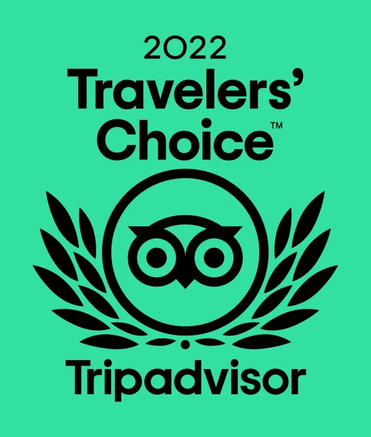 A green award graphic displays the 2022 Travelers’ Choice mark and Tripadvisor branding.