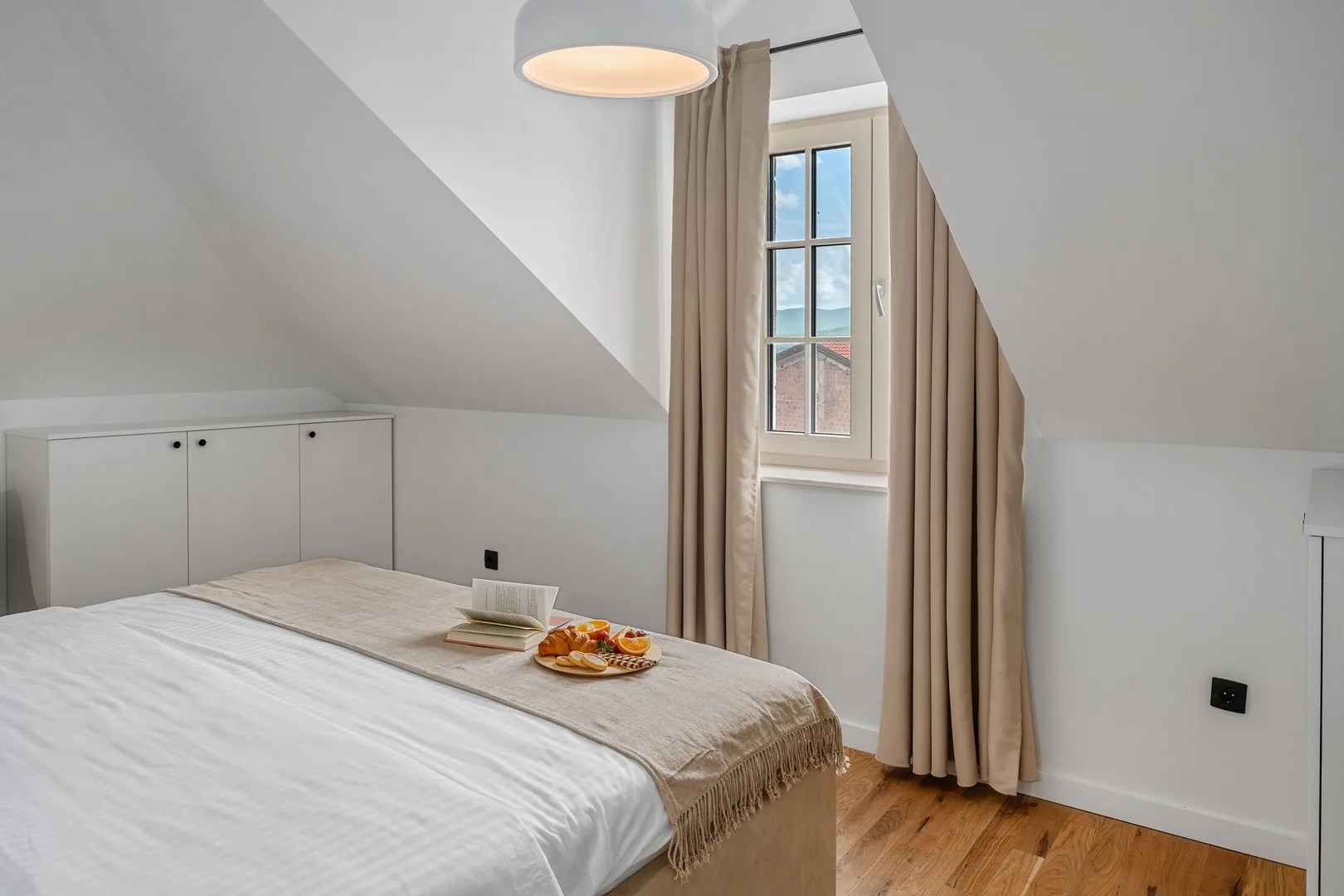A tranquil haven complete with an en-suite bathroom featuring a rejuvenating shower.