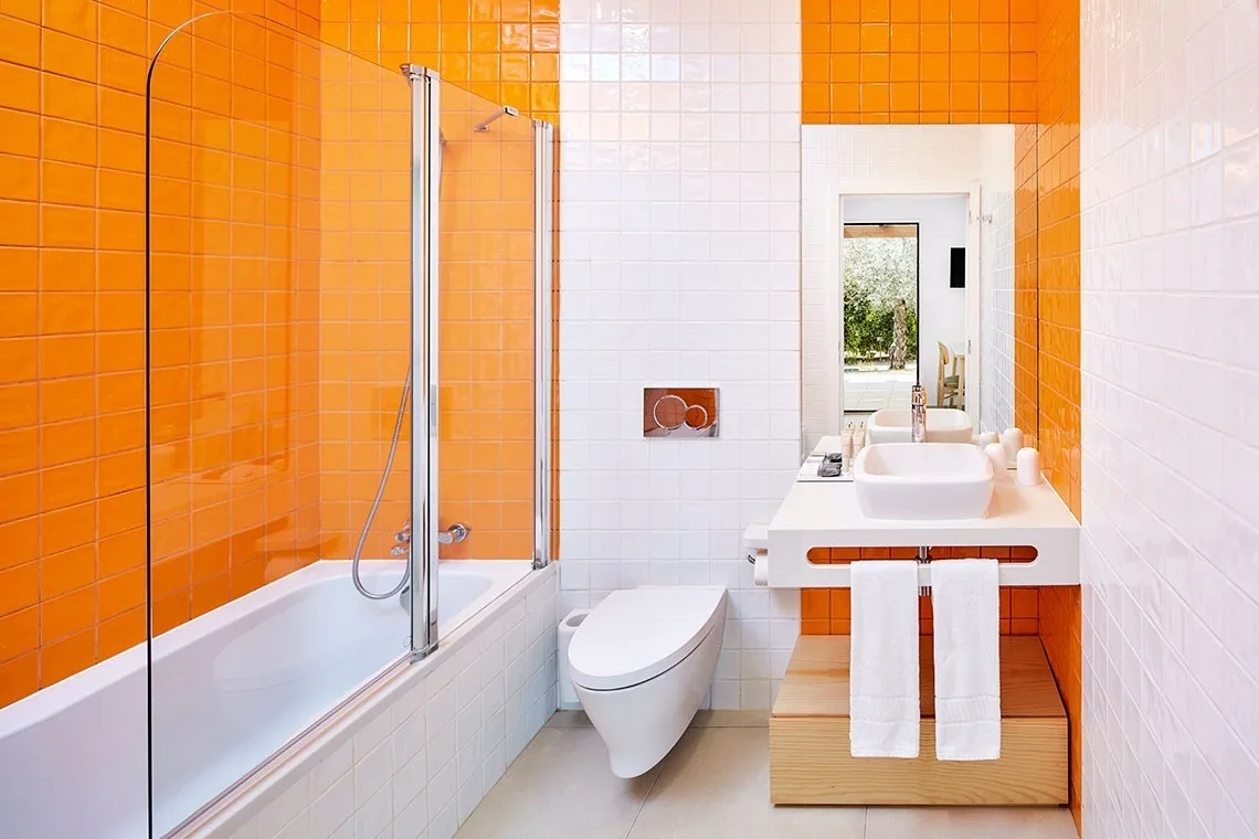 Double room with wood-effect wall covering and yellow throw.