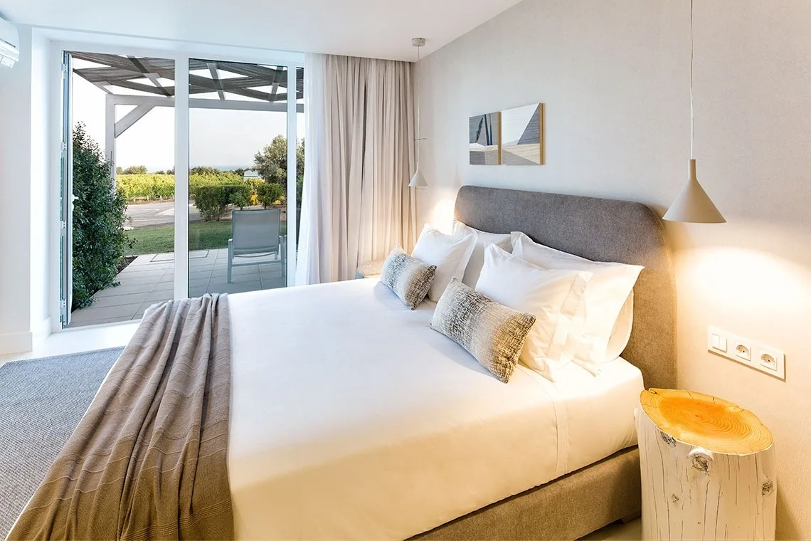 Guest room with a king bed and built-in wardrobe.