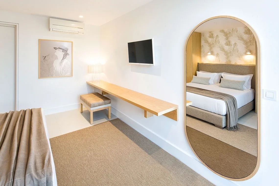Guest room with a king bed and built-in wardrobe.