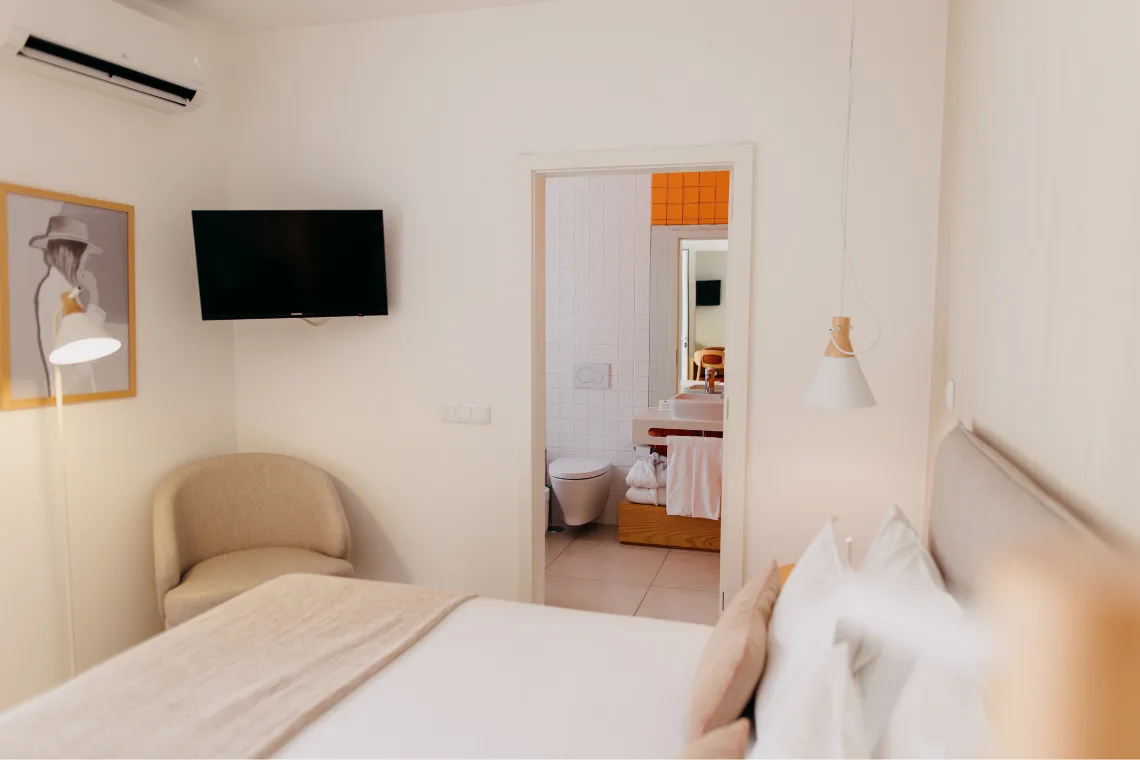 Guest room with a king bed and built-in wardrobe.