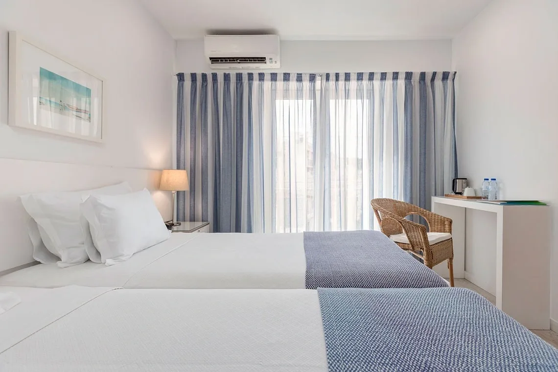 Hotel room with two beds and a table