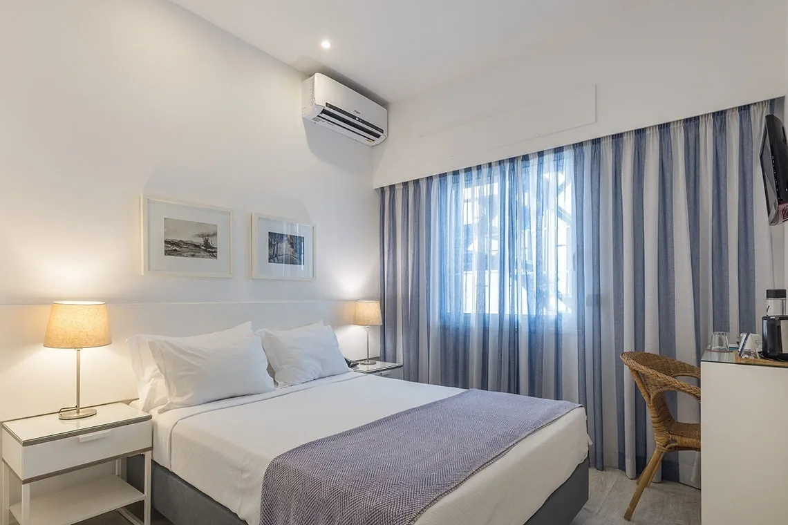 Hotel room with a bed and table
