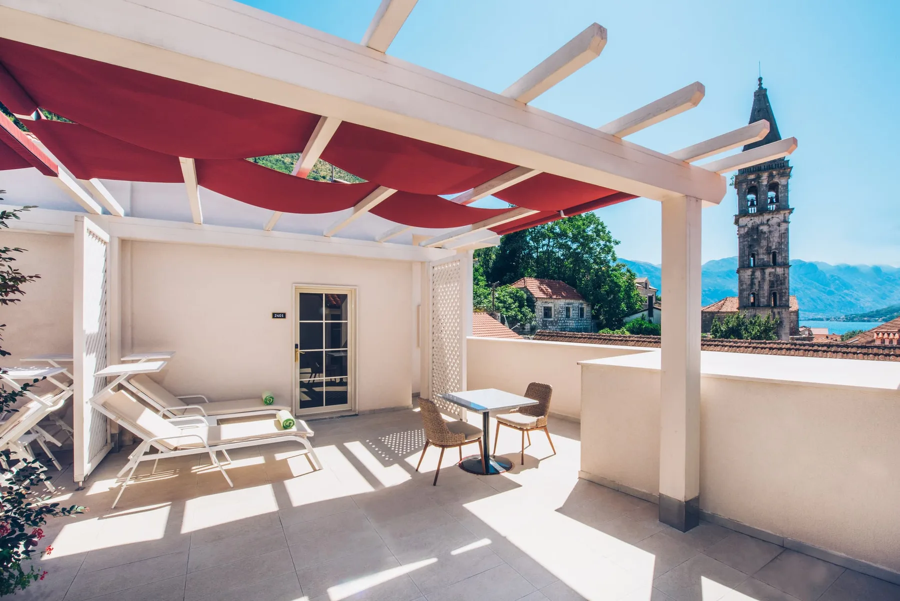 Terrace with sun loungers and a view over Montenegro