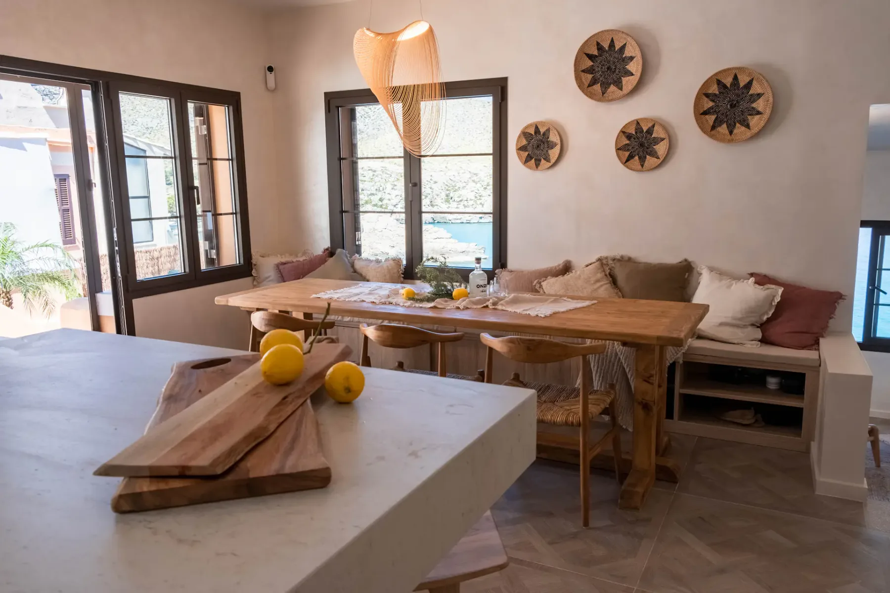 Dining area with a wooden table and built-in bench seating.