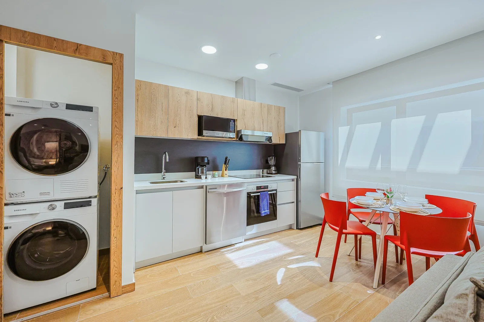 Your modern kitchen and dining space is bright and functional, with everything you need for a comfortable stay—including an in-unit washer and dryer for ultimate convenience.