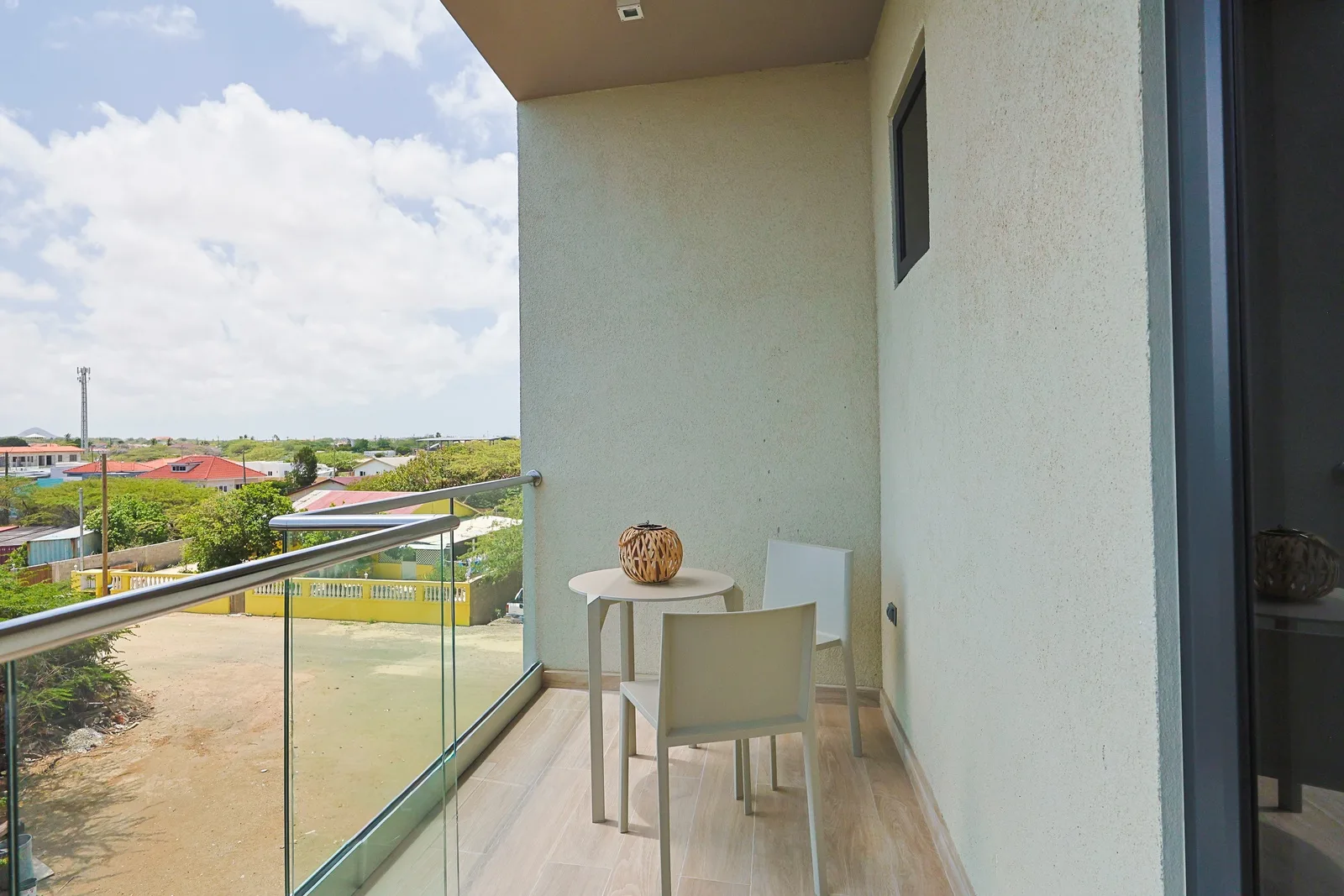 Step onto your private balcony and breathe in the fresh air while taking in neighborhood views. Enjoy your morning coffee at the small table, surrounded by peaceful surroundings.