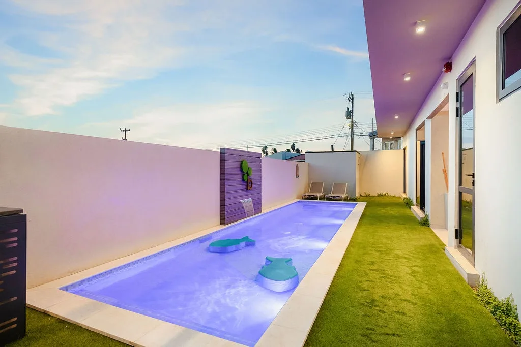 A charming kids’ pool nestled alongside the main lap pool, offering a safe and inviting space for little ones to splash, play, and enjoy the courtyard.