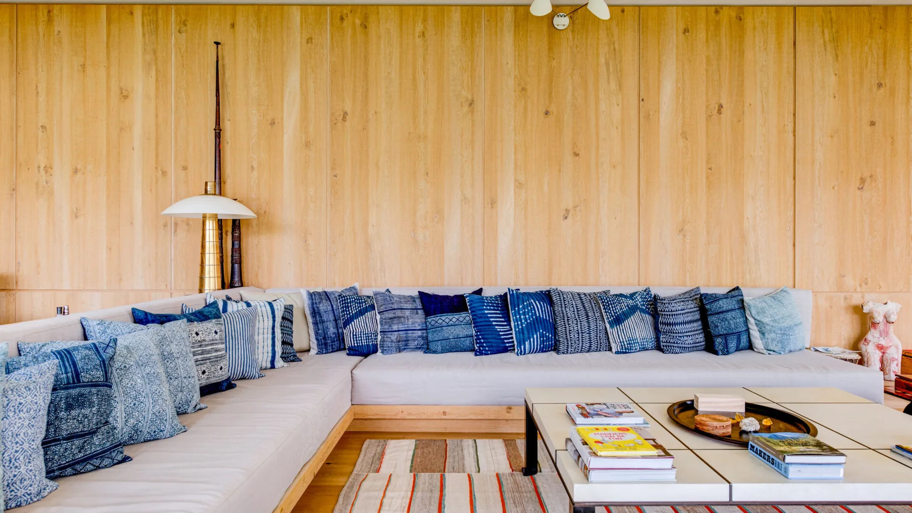 A living room with an L-shaped seating area and a low coffee table.