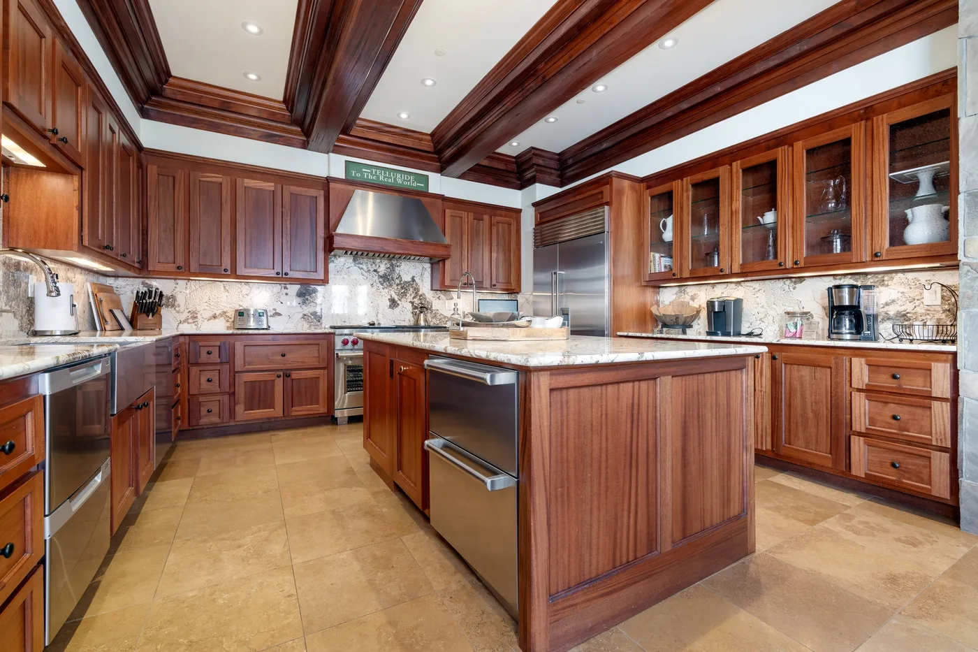 A spacious kitchen with dark wood cabinets and a central island.