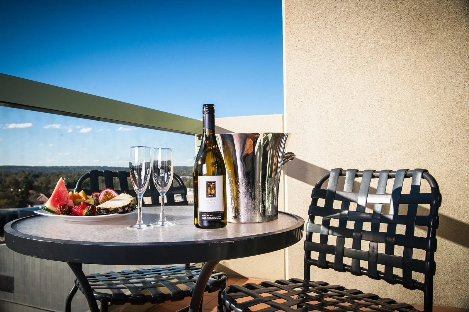 Drinks on an outdoor balcony at The Sebel Residence Chatswood