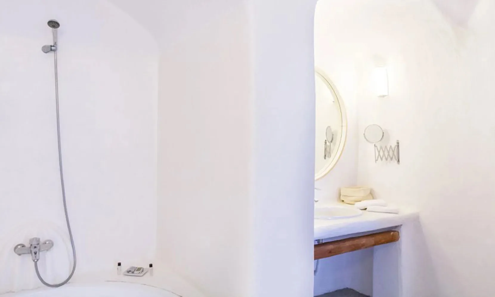 A bright bathroom with a shower and vanity.