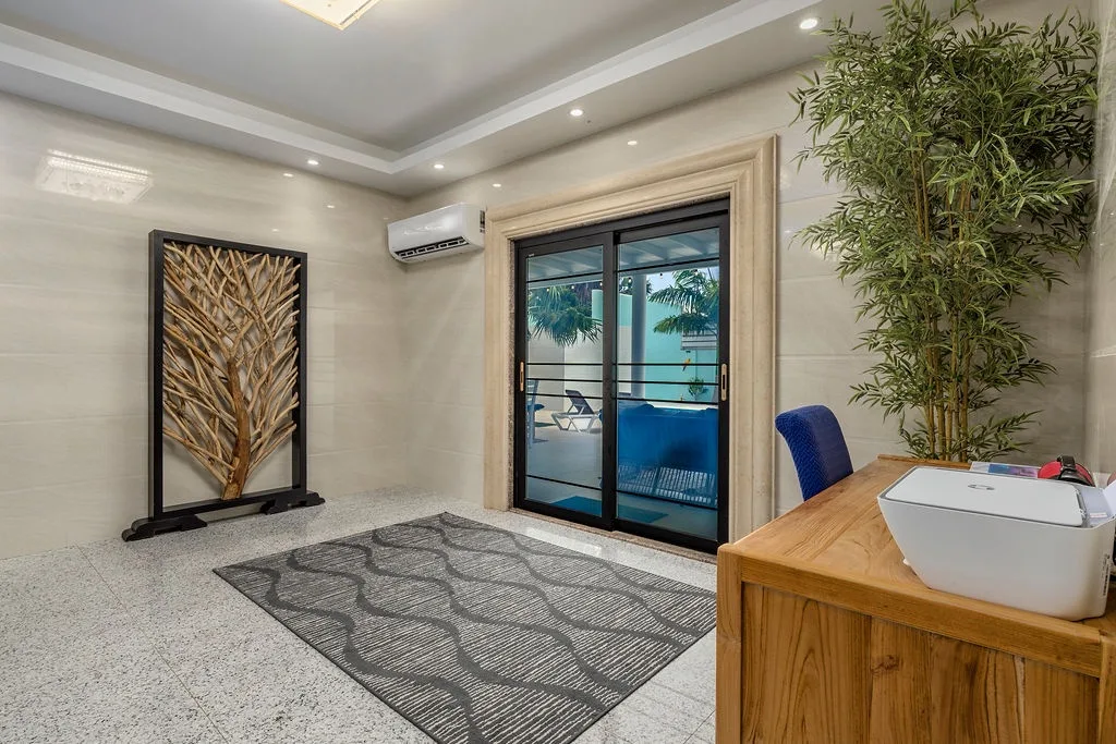 Step into a serene, elegantly designed space that welcomes you with warm lighting, modern décor, and direct access to your private pool retreat.