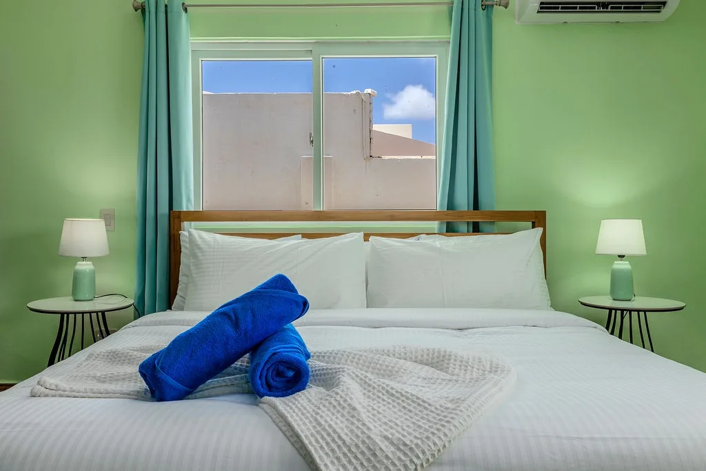 Sink into crisp linens and fresh towels after a day exploring. Cool off under the air conditioning and let the cheerful colors welcome you home.