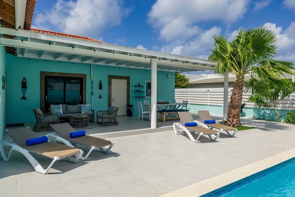 Soak up the sun on your private pool deck, where tropical palms sway overhead and comfortable loungers invite you to relax all day long.