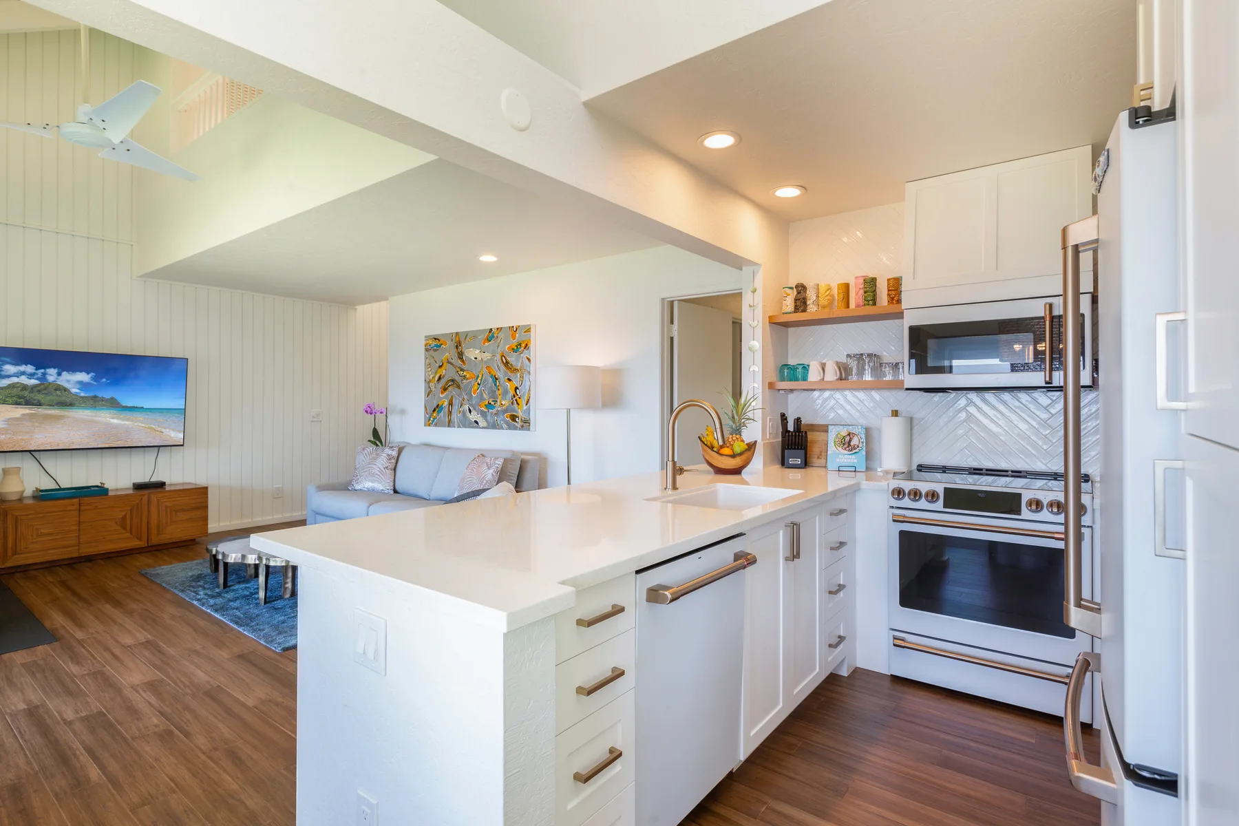 An open-plan kitchen and living area with a large island and seating.