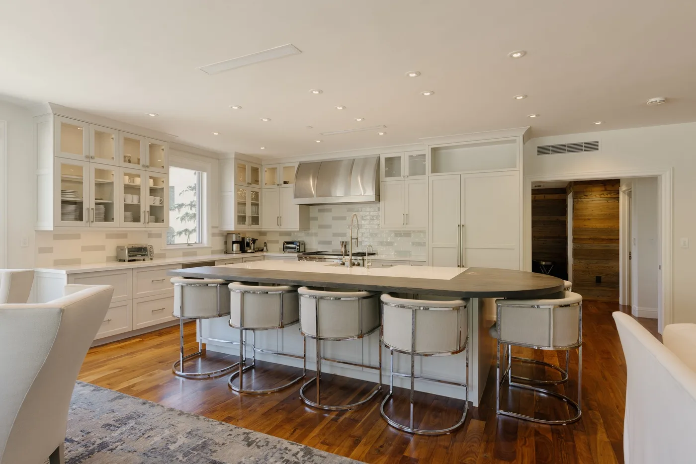 A bright kitchen with a large island and seating.