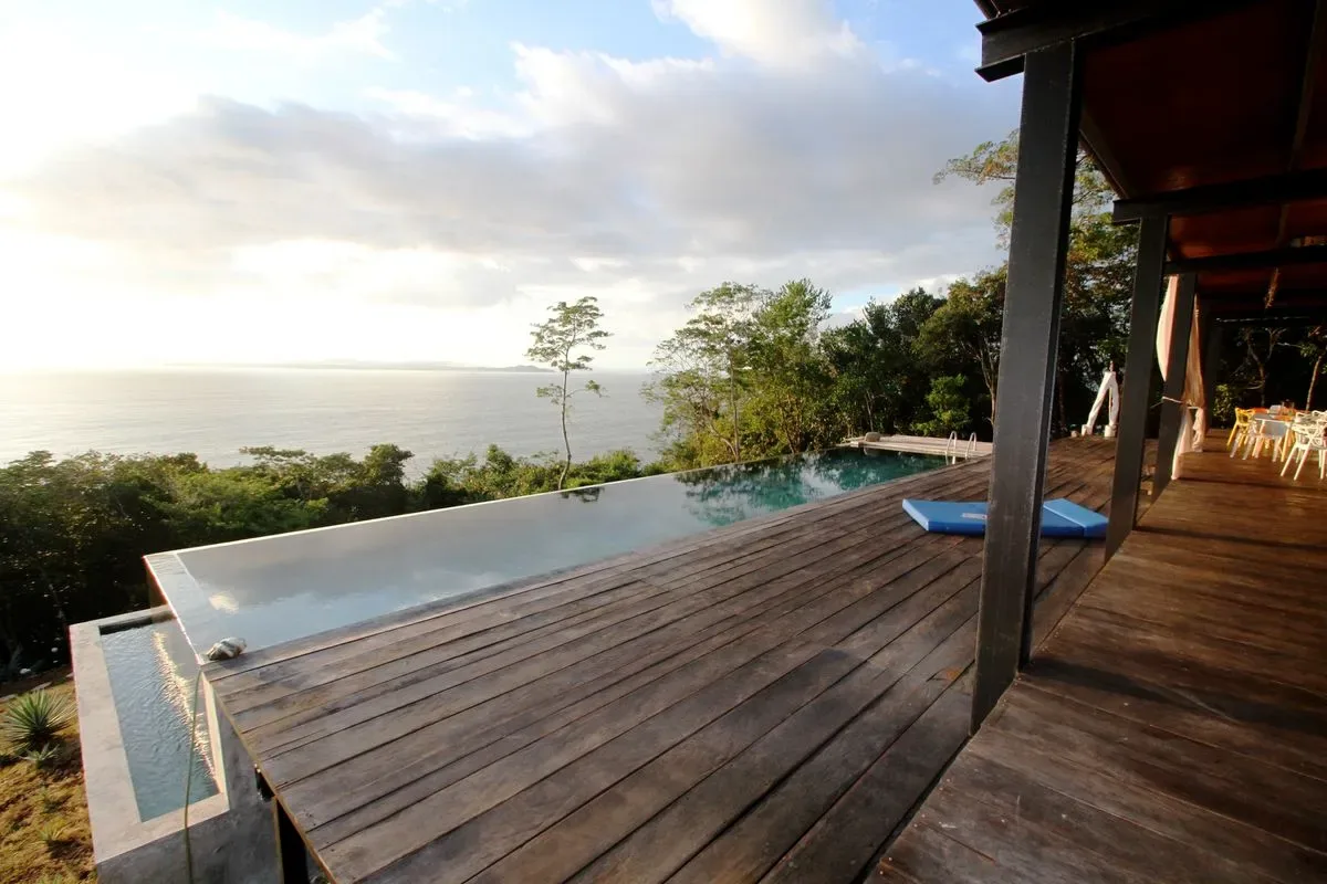 Infinity pool facing the forest and sea