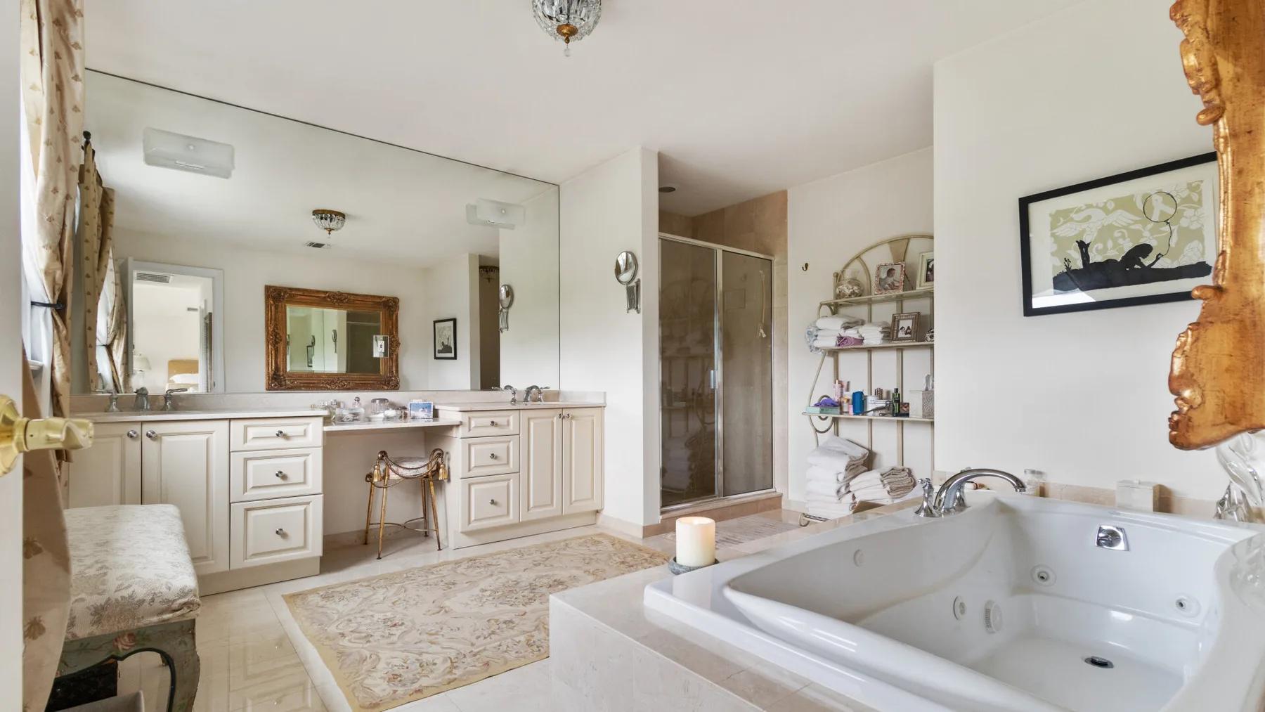 A bright bathroom with a large bathtub and vanity.