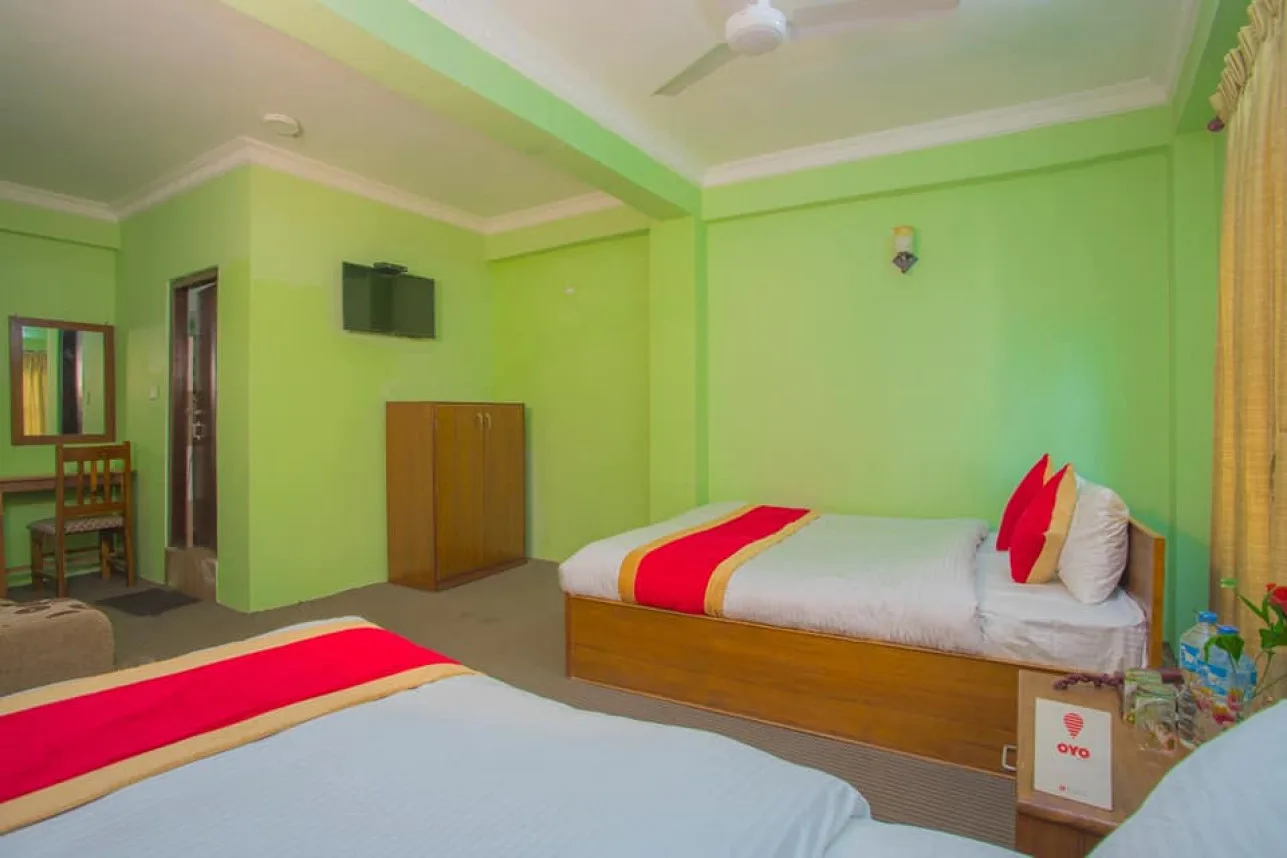 Room with one double bed and one single bed