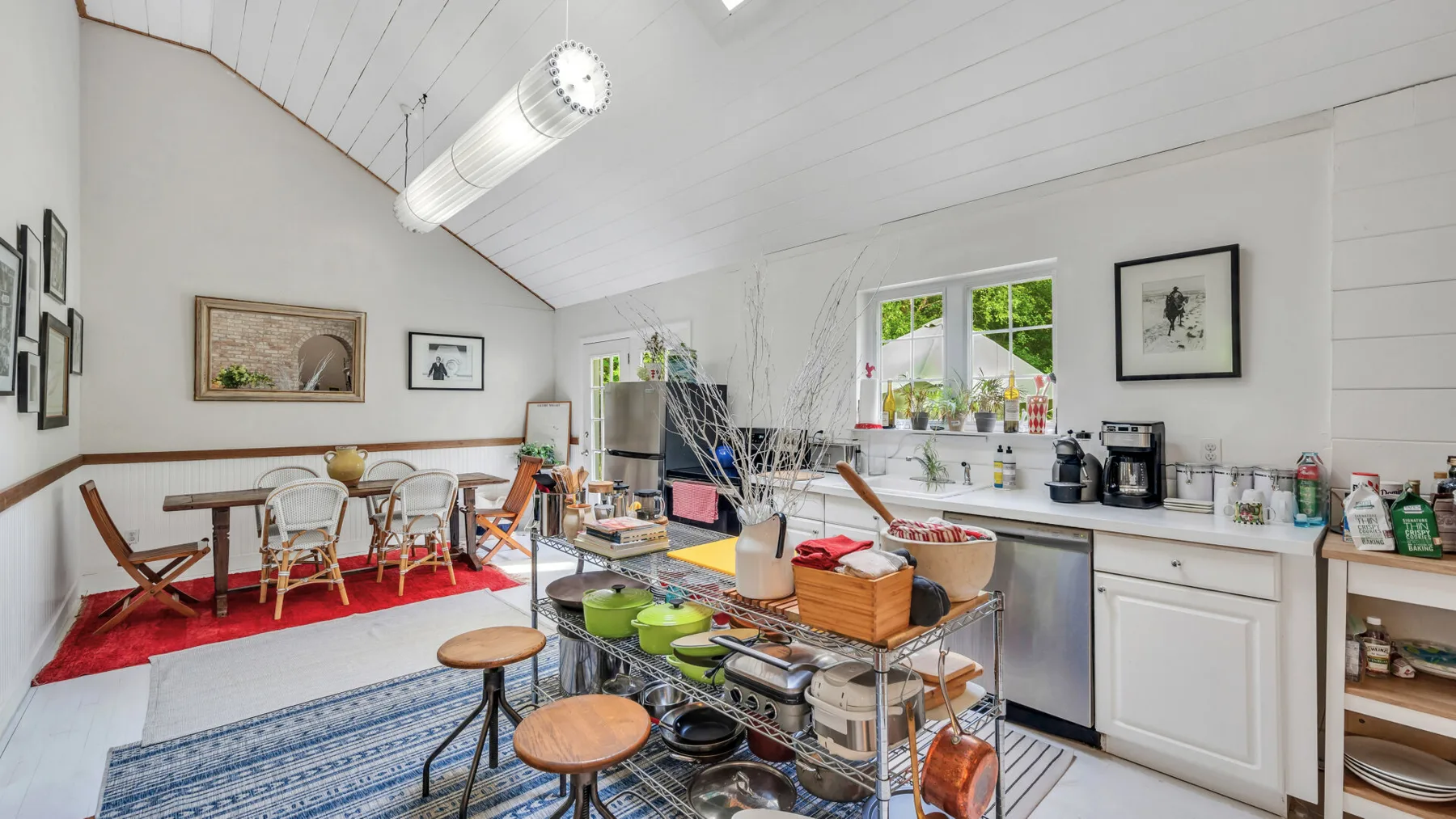 A bright kitchen and dining area with a large island and table.